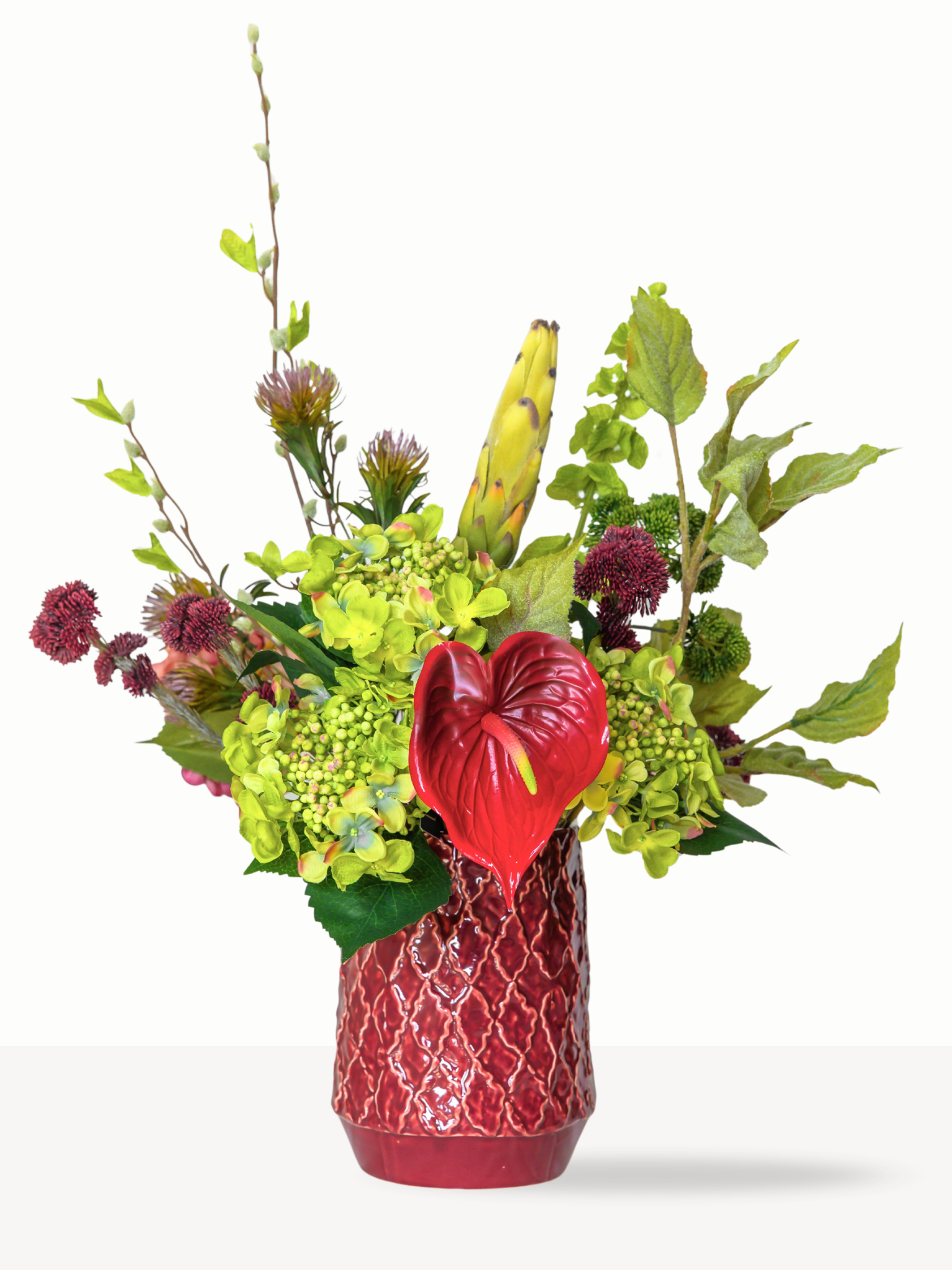 Luxe kunstboeket Babs met rode anthurium en groene molucella in vaas Pien - Blossig